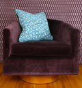 Teal and green mosaic floral hand-sewn decorative throw pillow with deep green contrast welt and tailored edges with velvet welt detail chair view Charlotte NC studio