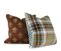 Blue geometric decorative pillow paired with green plaid throw pillow, hand-sewn by Liz Saintsing in Charlotte North Carolina