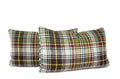 Blue geometric lumbar pillow paired with green plaid throw pillow, hand-sewn by Liz Saintsing in Charlotte North Carolina