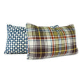Blue geometric lumbar pillow paired with green plaid throw pillow, hand-sewn by Liz Saintsing in Charlotte North Carolina