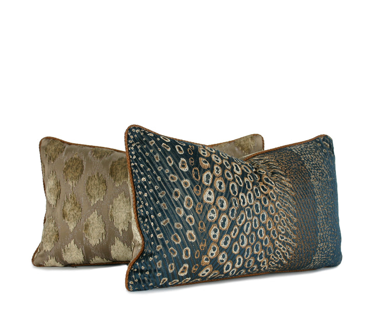 Navy-teal velvet lumbar pillow with gold embroidered animal motif and contrast welt, shown with coordinating neutral patterned pillow. Handmade in Charlotte NC, Liz Saintsing