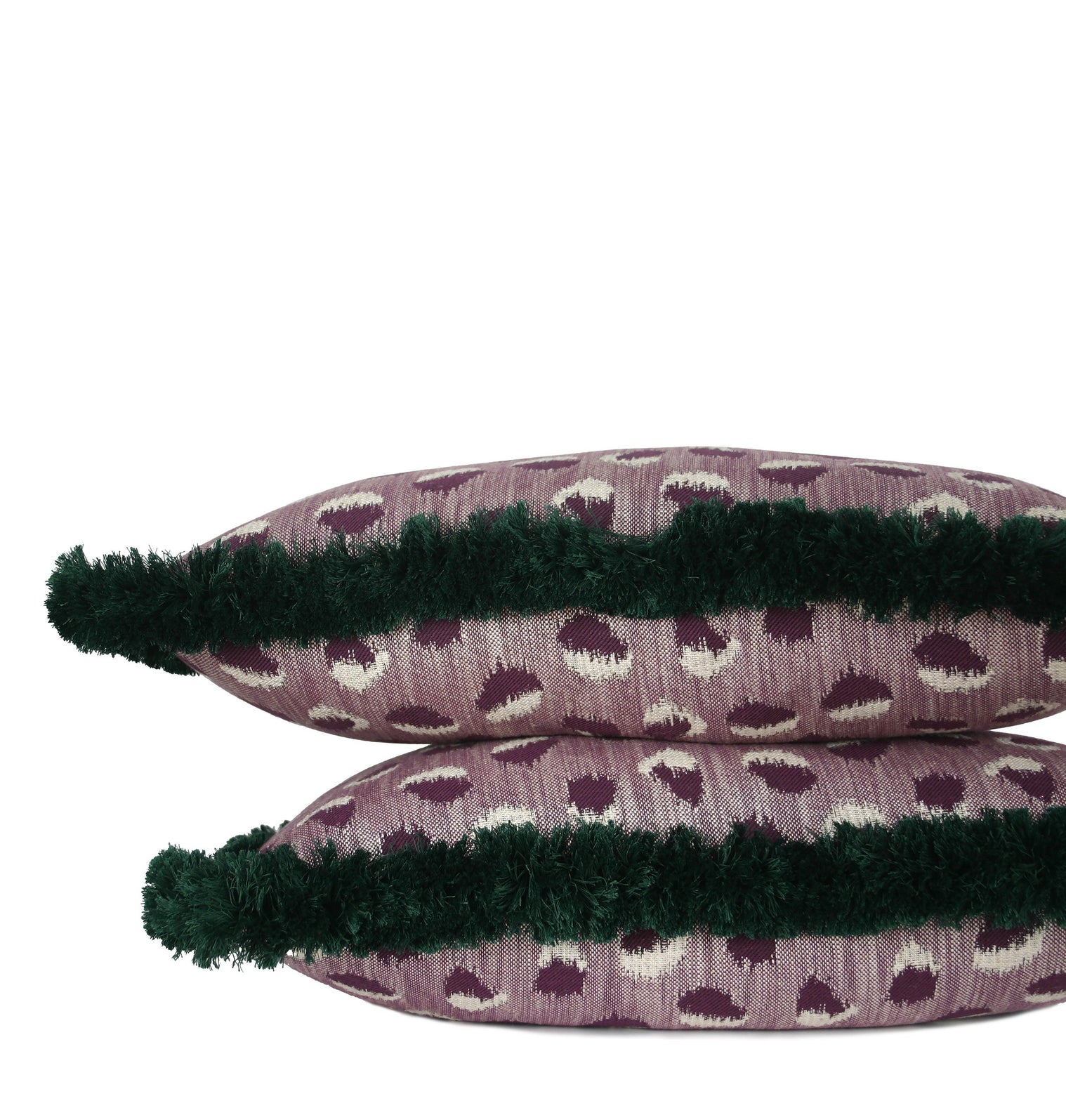 Handcrafted mauve lumbar pillow with abstract woven pattern and deep emerald brush fringe, individually sewn by Liz Saintsing in Charlotte, North Carolina.