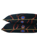Detailed close up of pair of abstract navy decorative lumbar pillow with magenta lines, cobalt blue accents and metallic gold cord. Hand-sewn in Charlotte NC by Liz Saintsing.
