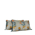 Pair of painterly woven decorative lumbar pillow in blue, coral and ochre with graduated blue tassel fringe. Hand-sewn in Charlotte NC by Liz Saintsing.