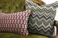 Green chevron woven decorative lumbar pillow with plum floral reverse and contrast leather welt sofa view hand-sewn in Charlotte North Carolina